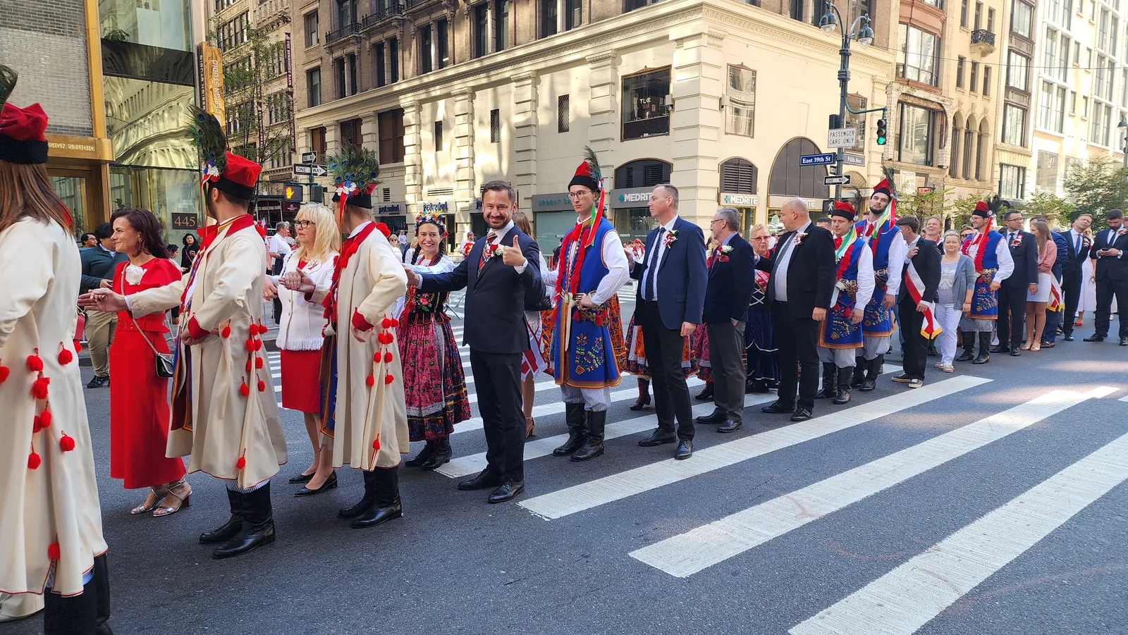 Participants in traditional Kraków folk costumes at a Polish parade in New York