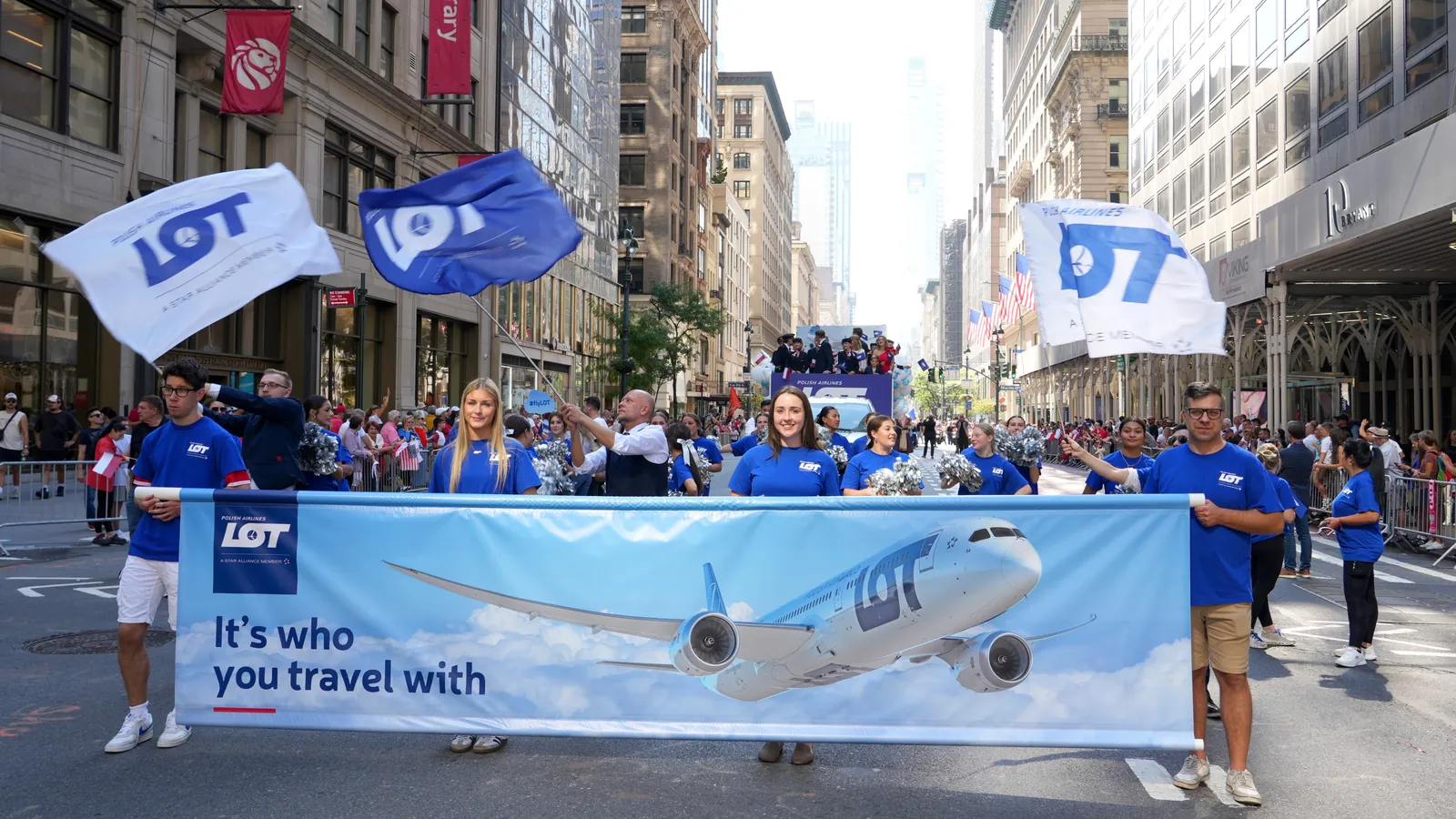 LOT Polish Airlines team with flags and a banner at the Pulaski Parade in New York