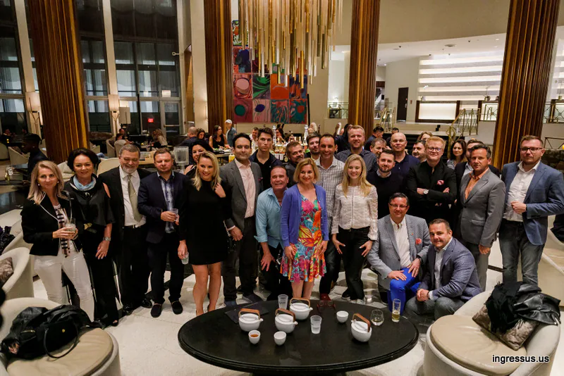 Group of 60 Million Congress participants posing together in the hotel lobby in Miami Beach