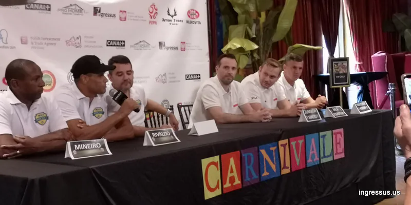 Press conference at Carnivale with Brazil Legends players Mineiro and Rivaldo behind name cards, next to Poland Legends players