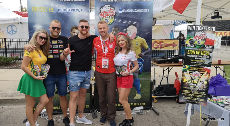 Promo team in Brazil and Poland outfits at the Soccer Legends Cup booth, with a win tickets sign-up poster and a gala poster