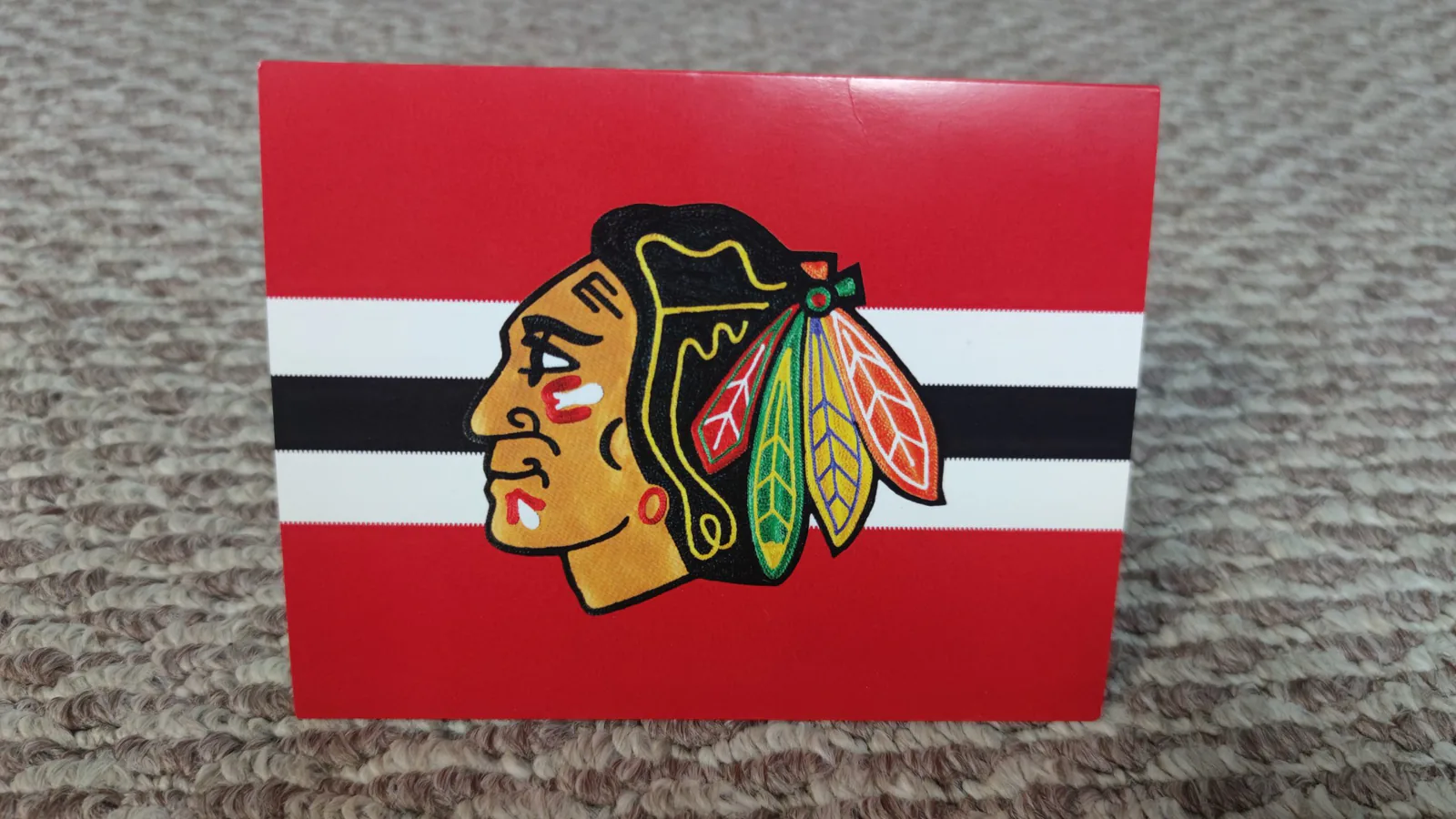 Folded greeting card with the Chicago Blackhawks logo on red, white and black stripes, received after Polish Heritage Night