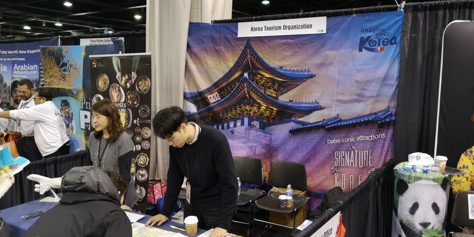 Korea Tourism Organization booth with an Imagine Your Korea palace backdrop at the Chicago Travel & Adventure Show 2019