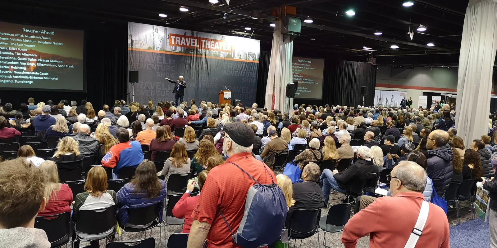Speaker on the Travel Theater stage with Reserve Ahead slides on European sights, before a full audience in Rosemont, 2019