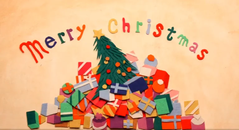 Merry Christmas lettering above a Christmas tree and a pile of gifts, all made of colorful felt, for the Ingressus Christmas 2020 greetings