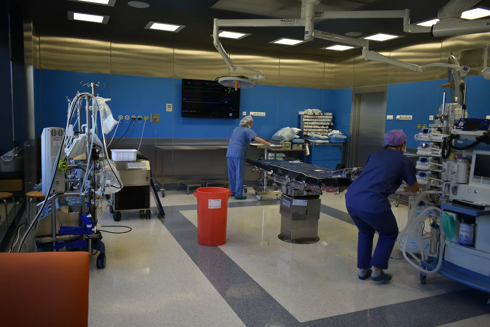 Hybrid operating room at American Heart of Poland in Bielsko-Biała, with staff in scrubs preparing the room