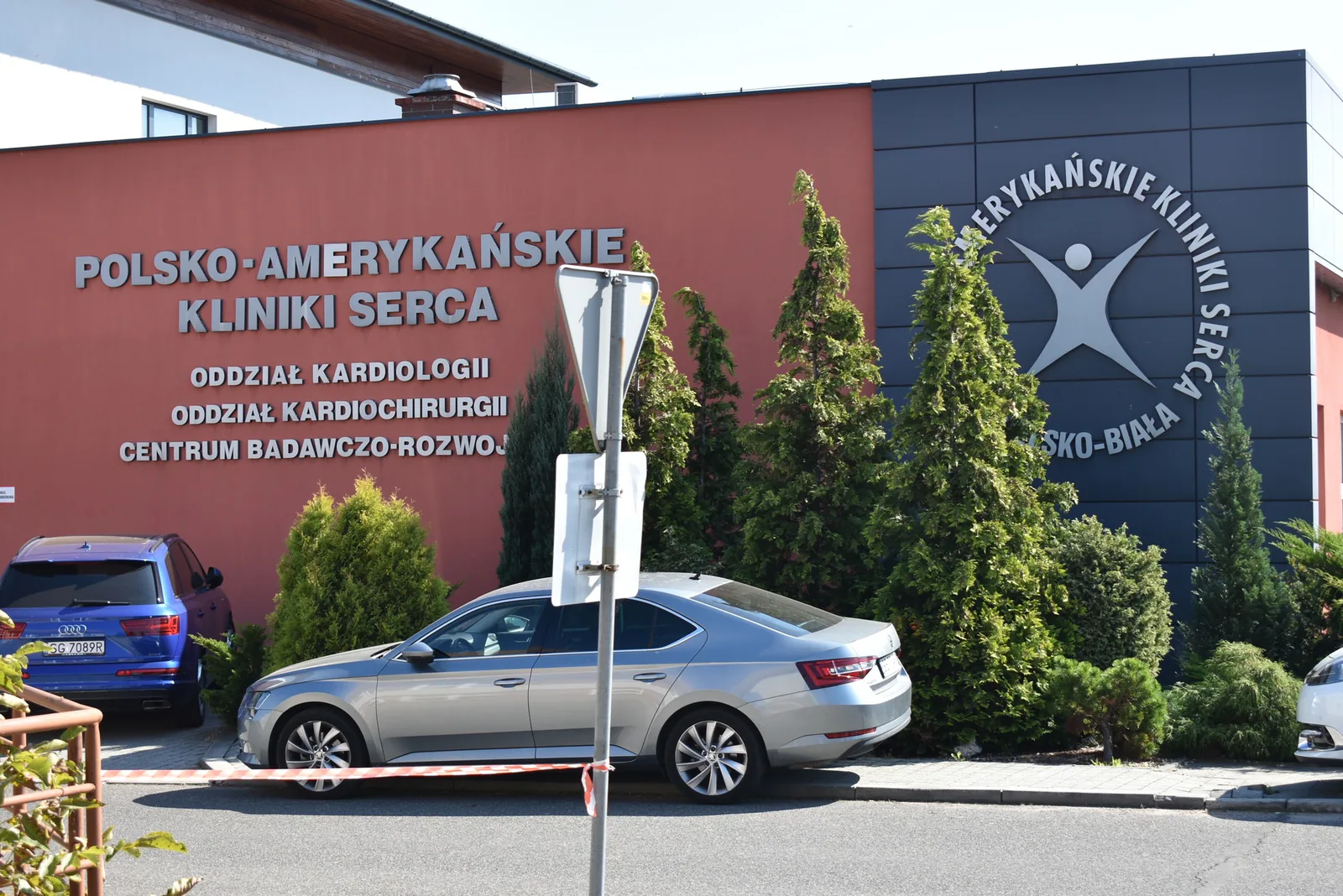 American Heart of Poland clinic in Bielsko-Biała, with signs for the cardiology and cardiac surgery wards and the R&D center