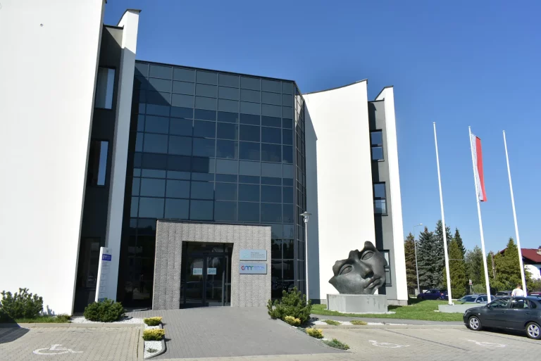 Dr Sirek MedCosmetic plastic surgery clinic and CMR Hospital building in Bielsko-Biała, with a large bronze face sculpture by the entrance