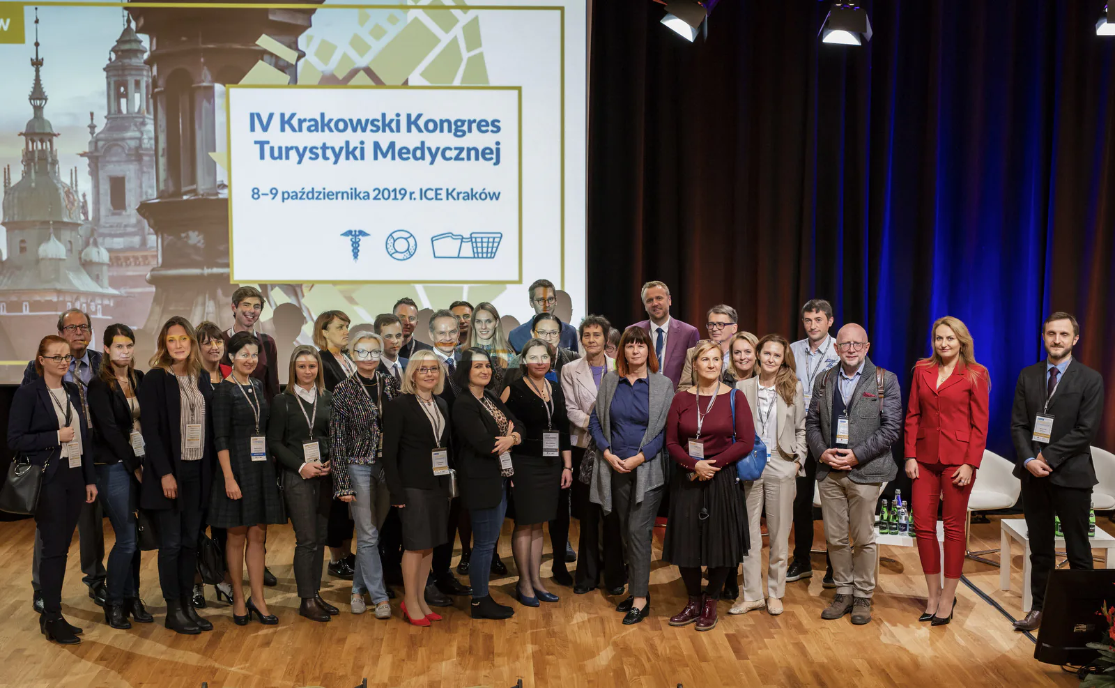 Group photo of speakers and participants of the 4th Kraków Medical Tourism Congress on the ICE Kraków stage
