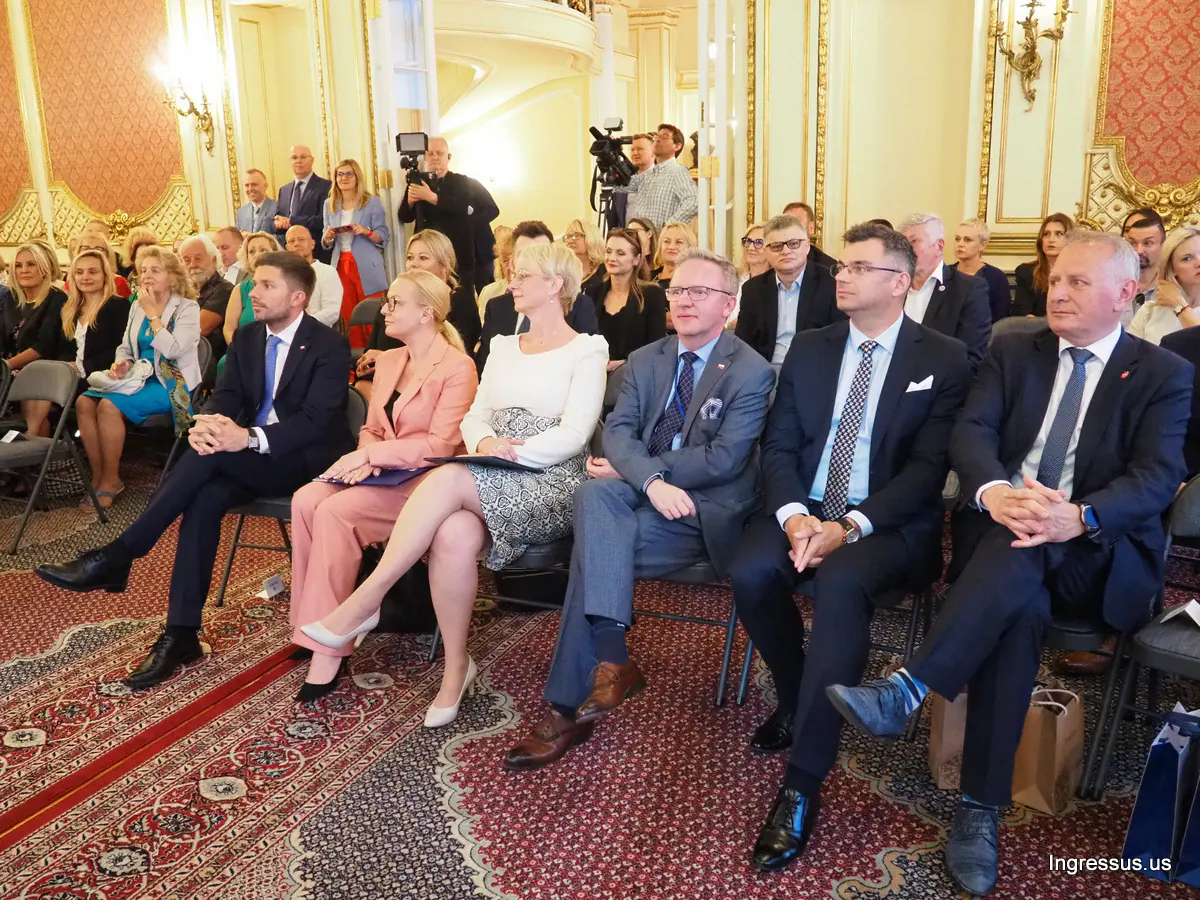 Guests seated in the front rows of an ornate hall, with TV cameras behind them, at the Małopolska presentation in New York