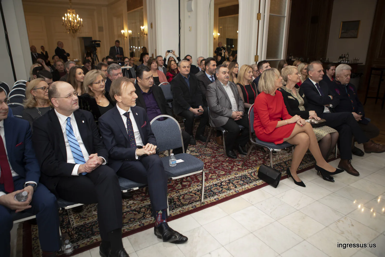 Full room of seated guests under a chandelier at the Małopolska promotional event at the Polish Consulate General in Chicago