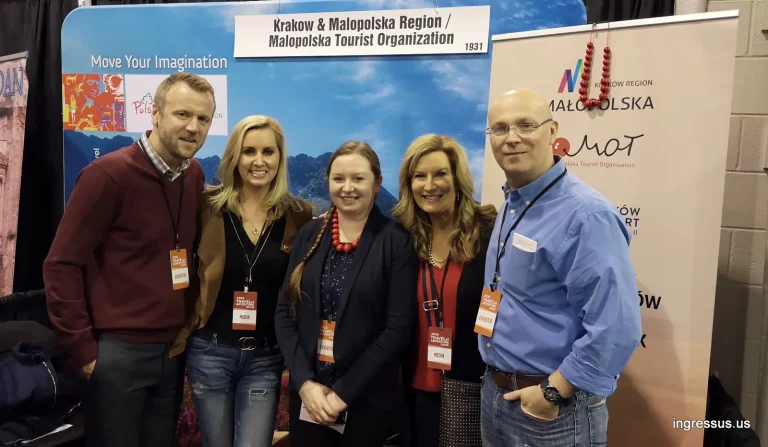 Five people with exhibitor and media badges at the Krakow and Malopolska Region booth at the 2020 Travel and Adventure Show in Rosemont