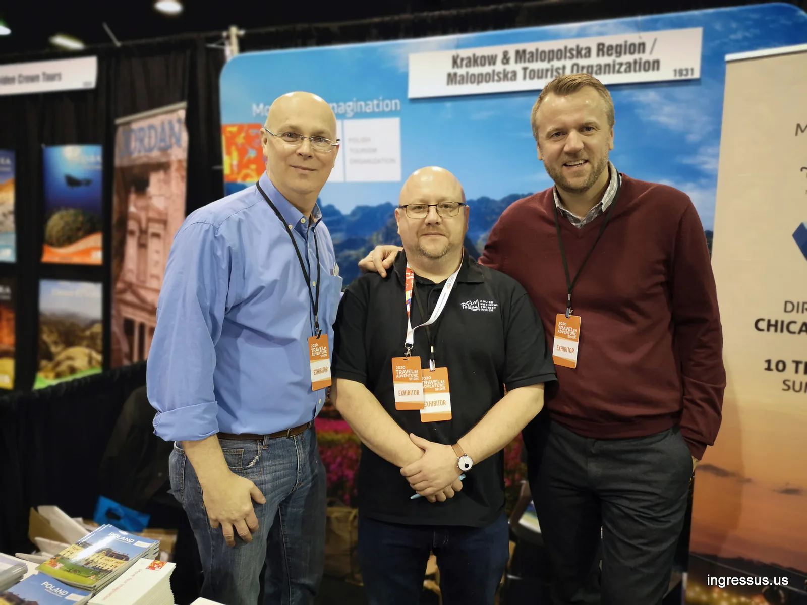 Three exhibitors posing at the Kraków and Małopolska Region / Małopolska Tourist Organization booth at the 2020 Travel & Adventure Show