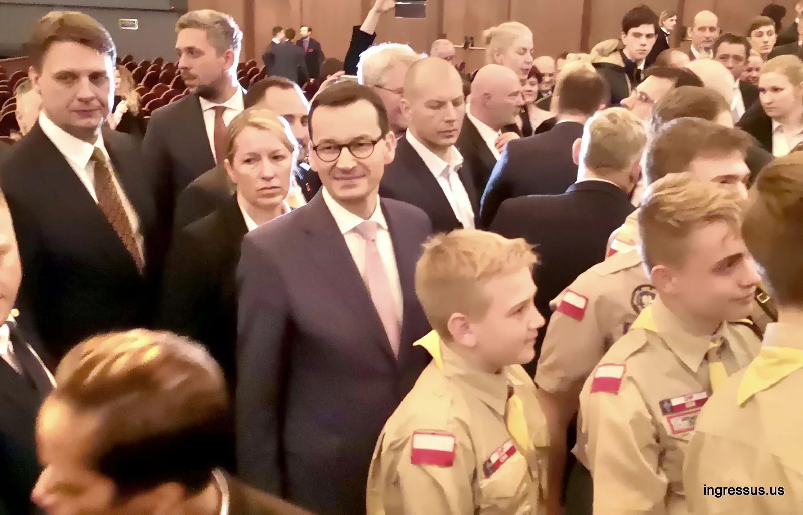 Prime Minister of Poland Mateusz Morawiecki among guests and young Polish scouts in uniform at the premiere in Chicago