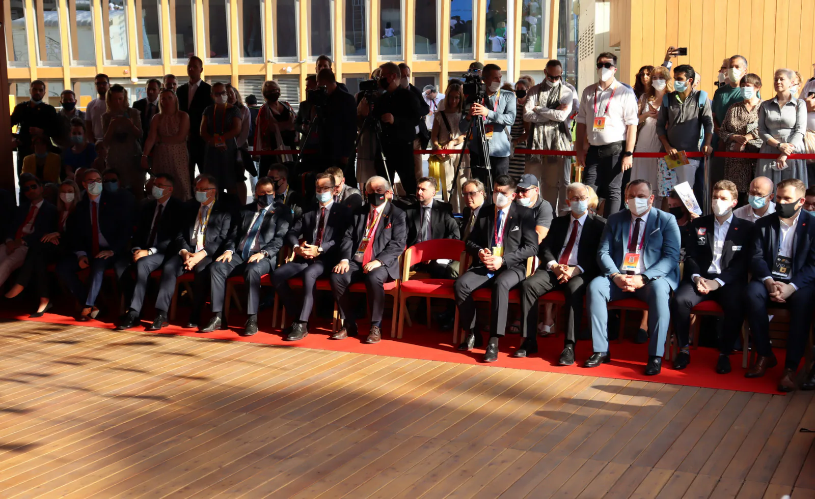 Guests seated in the front row with camera crews behind them at the Poland National Day ceremony at Expo 2020 Dubai