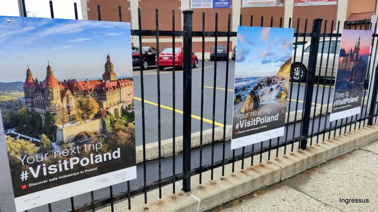 #VisitPoland posters of Książ Castle and the Baltic Sea on the fence of the Copernicus Foundation building in Chicago