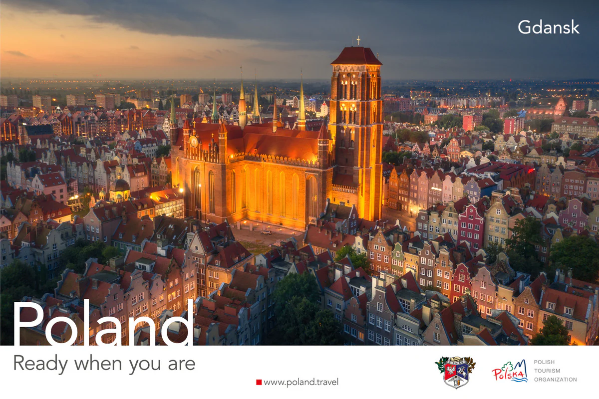Poland, Ready when you are poster showing the illuminated St. Mary's Church above the Gdańsk old town at dusk