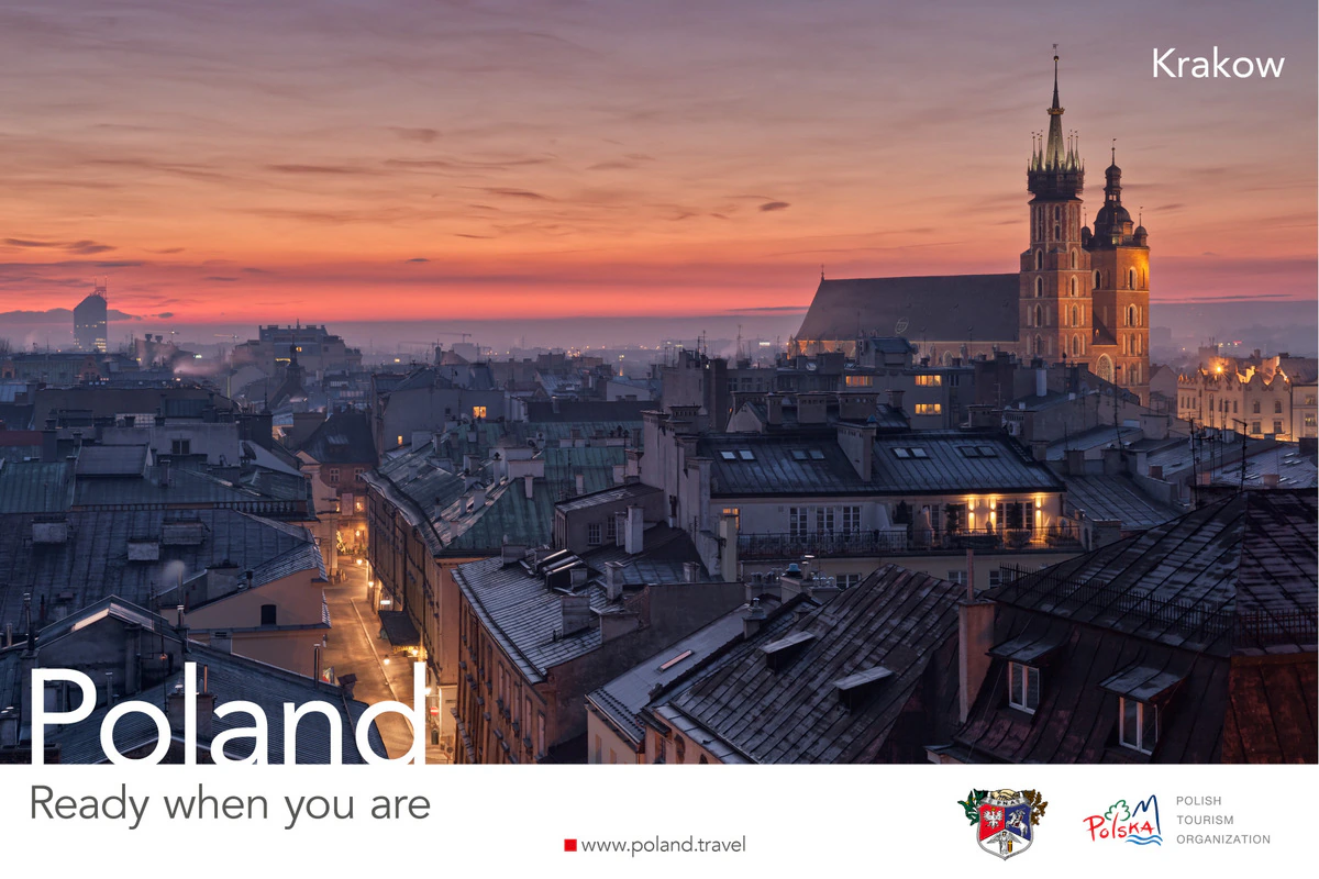 Poland, Ready when you are poster showing Kraków rooftops and St. Mary's Basilica towers at dusk
