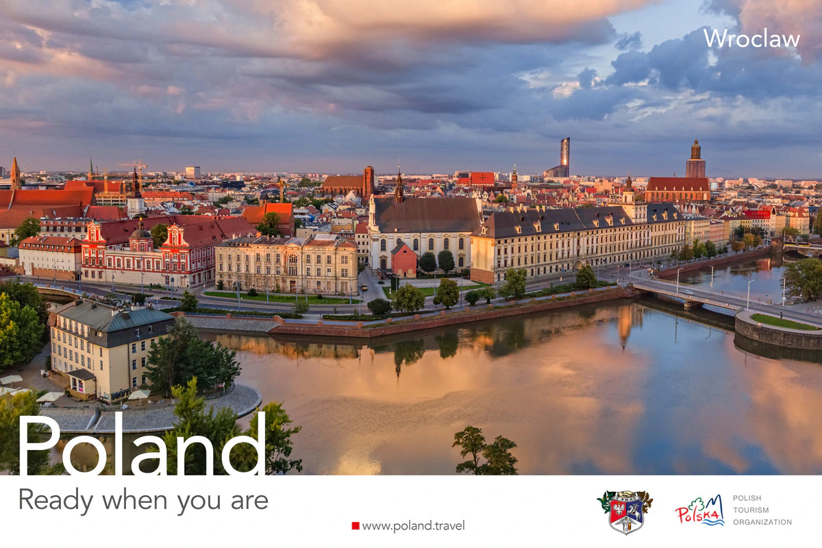 Poland, Ready when you are poster showing the Wrocław skyline and riverfront reflected in the river at sunset