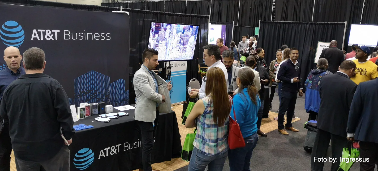 Attendees talking with exhibitors at the AT&T Business booth at Small Business Expo 2019 in Chicago