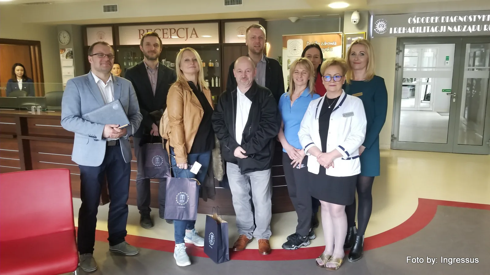 Study tour group with hosts at the reception of a diagnostics and rehabilitation center at a Polish spa, 2019